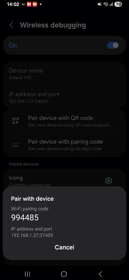 Wireless Debugging pairing code screen showing IP, port, and 6-digit code